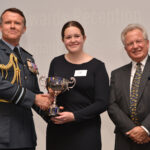 2022 Evelyn Saunders Memorial Cup winner, Grace Cartwright, with Air Vice-Marshal Simon Edwards (left) and Sir Christopher Harper (right).